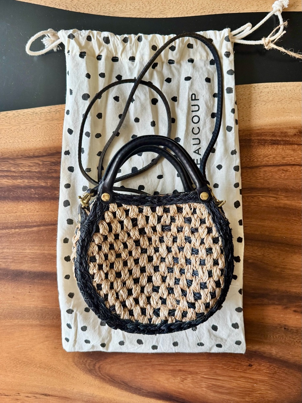 Lil Bébé Black and Natural Woven Round Crossbody